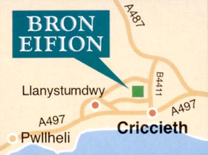 We are on the back road between Criccieth and Llanystymdwy - look for the brown Tourist Information signs marked Bron Eifion and featuring a Fish icon